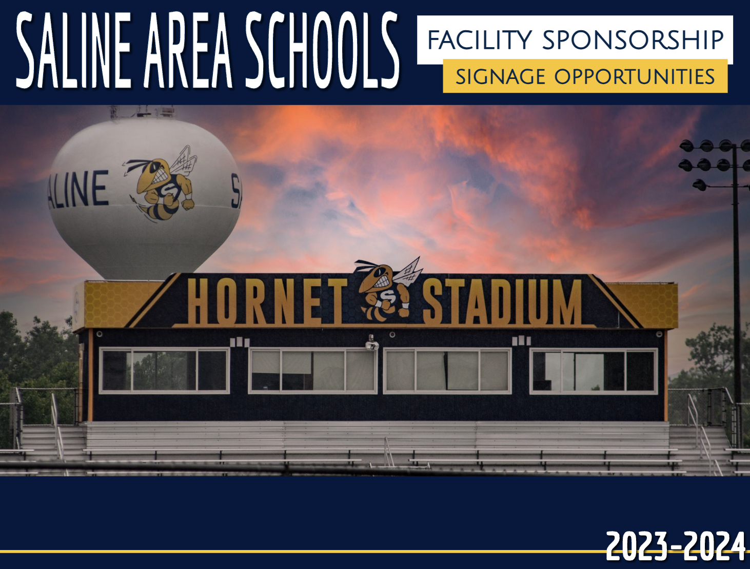 Hornet Stadium Press Box with colorful sunset and Saline Hornet on water tower